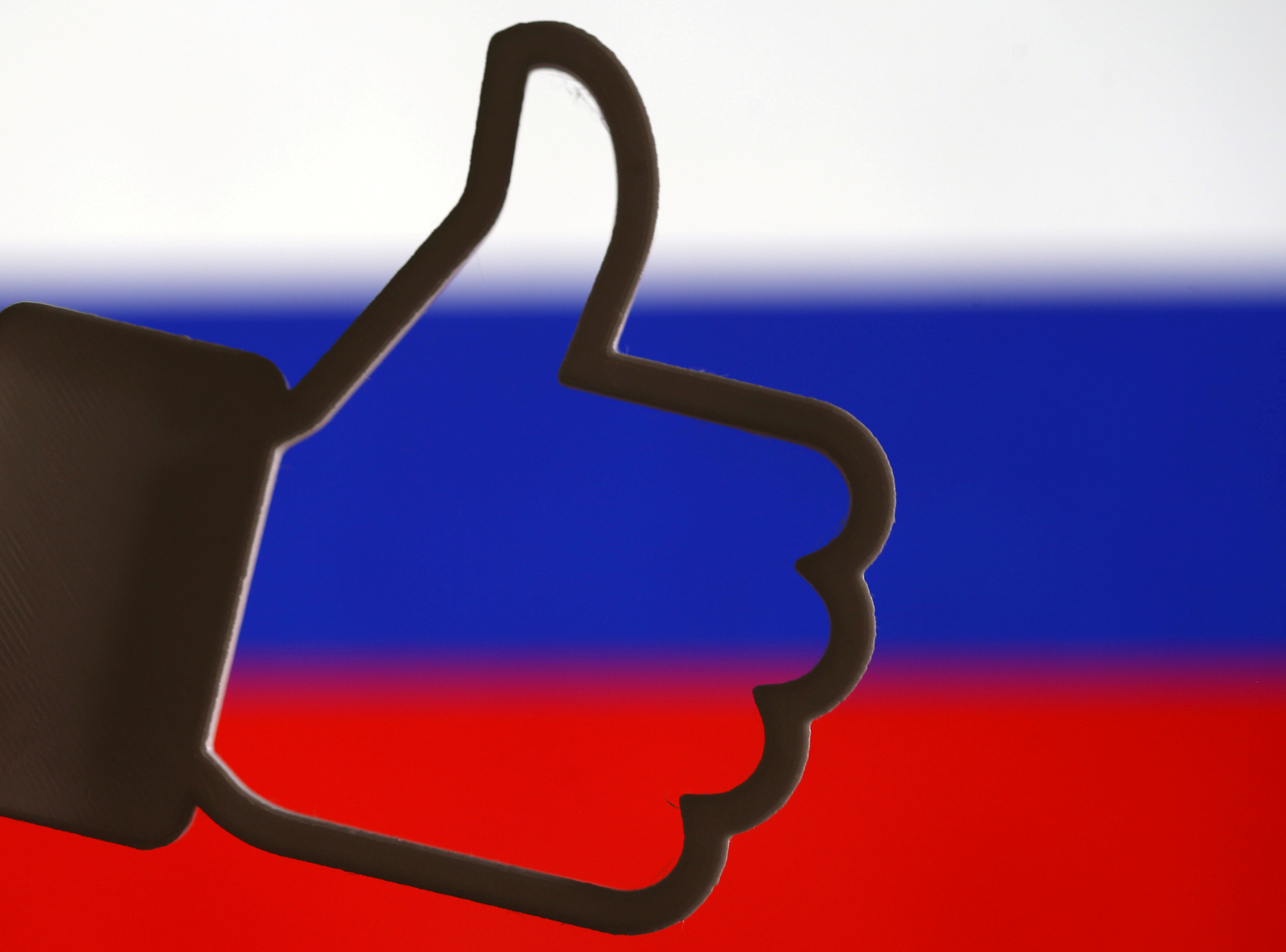 A 3D-printed Facebook like button is seen in front of a displayed Russian flag in this illustration taken October 25, 2017. u00e2u20acu201d Reuters pic