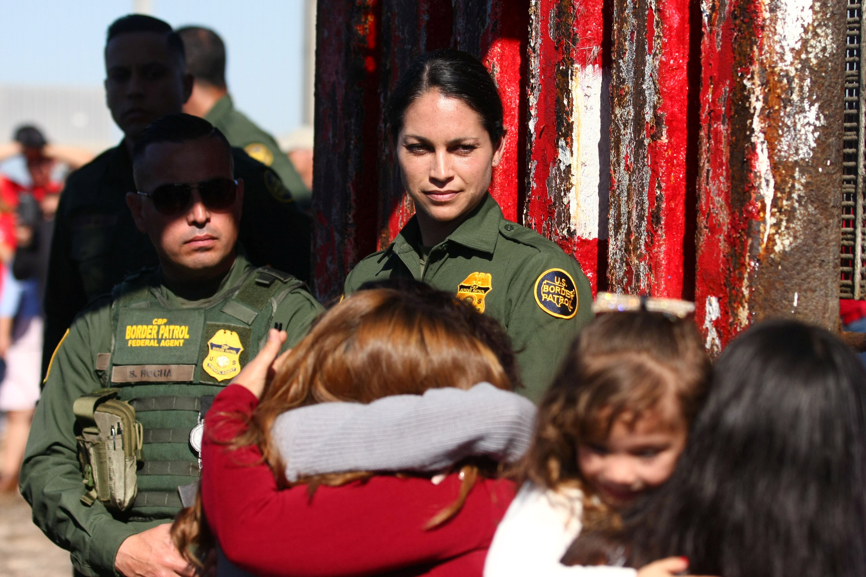 A member of the US Border patrol agent watches as she open a single gate to allow families to hug and converse along the Mexico and US border in Tijuana, Mexico, November 18, 2017. u00e2u20acu201d  Reuters pic