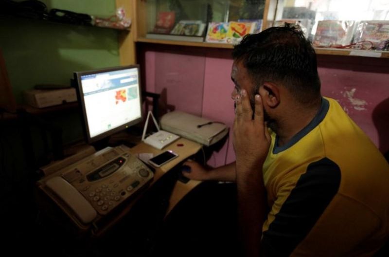 A man explores social media on a computer at an internet club in Islamabad, Pakistan, August 11, 2016. Picture taken August 11, 2016. REUTERS/Faisal Mahmood
