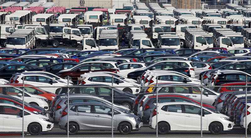 Newly manufactured cars await export at port in Yokohama, Japan November 15, 2017. u00e2u20acu201d Reuter