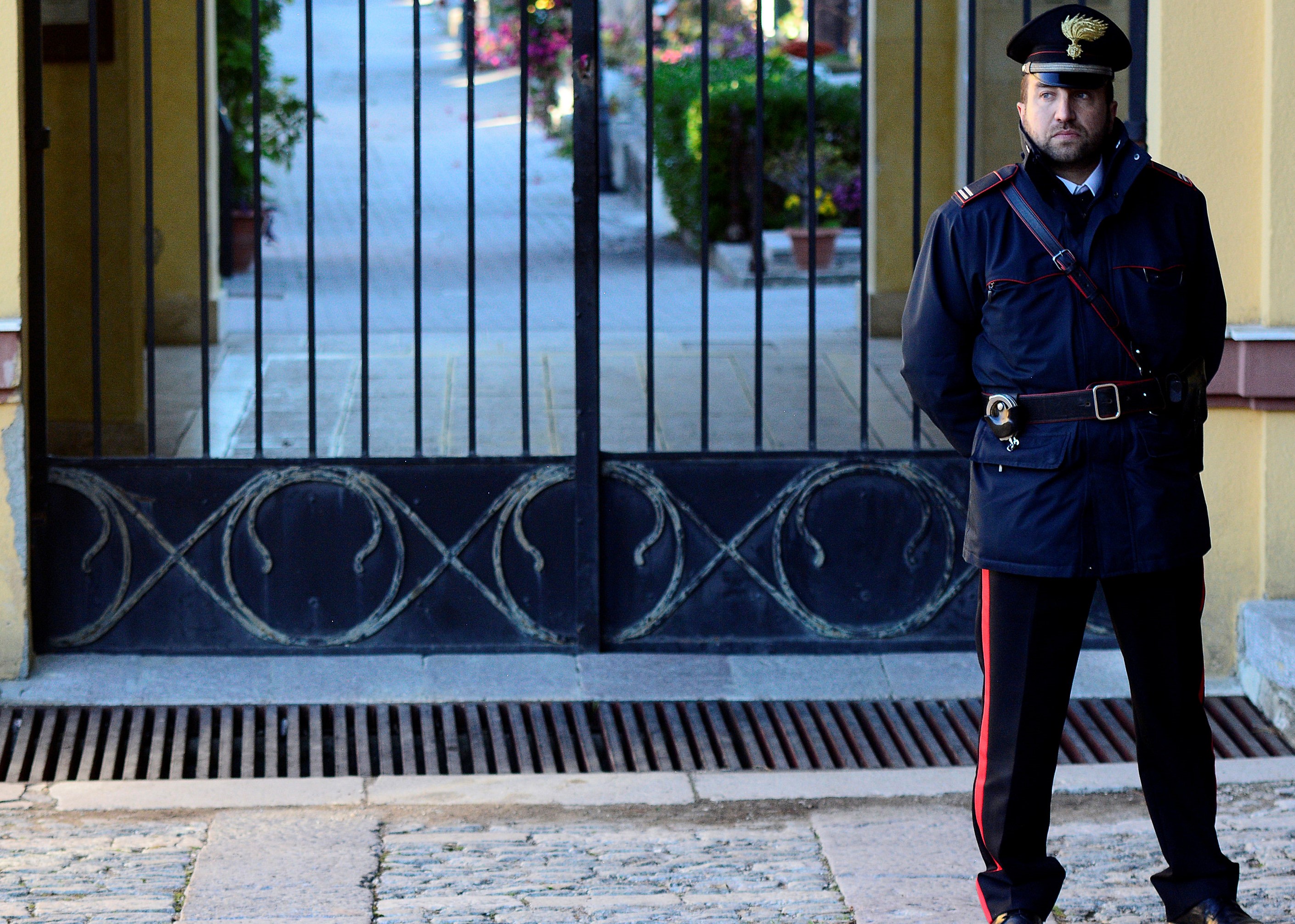 An Italian Carabinieri police officer patrols outside the cemetery in Corleone, Italy November 22, 2017. u00e2u20acu201d Reuters pic