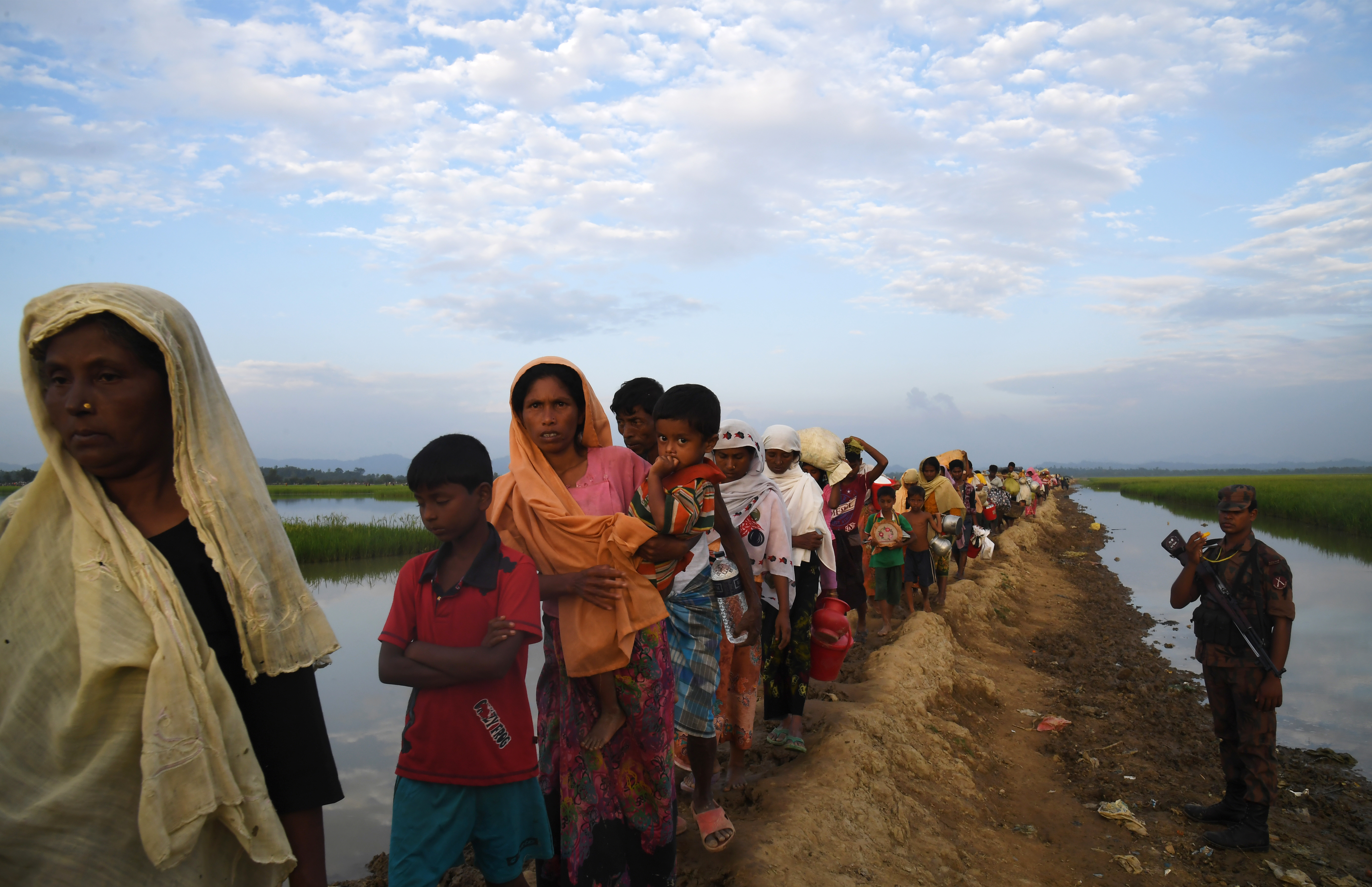 Rohingya Muslim refugees who were stranded after leaving Myanmar walk towards the Balukhali refugee camp after crossing the border in Bangladesh's Ukhia district on November 2, 2017. u00e2u20acu201d AFP pic