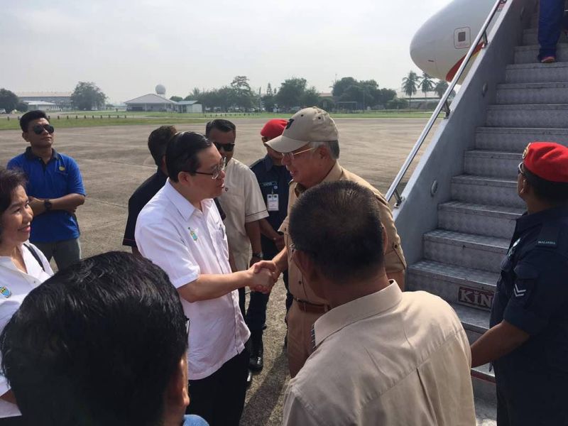Penang Chief Minister Lim Guan Eng greets Datuk Seri Najib Razak at the Seberang Perai Tengah District and Land Office, November 7, 2017. u00e2u20acu2022 Picture via Facebook/CM Lim Guan Eng