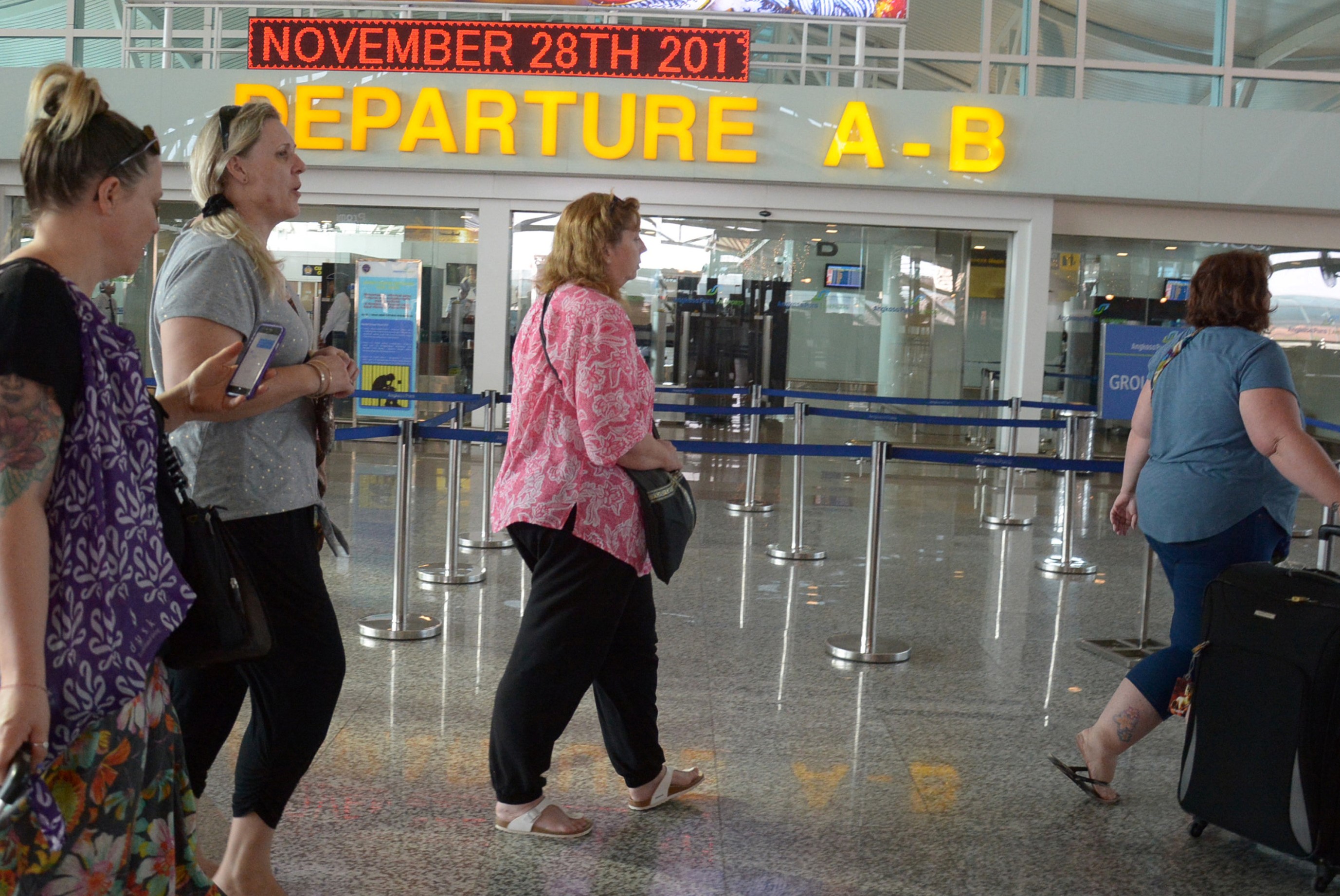 nTourists walk while looking for flights as Ngurah Rai airport is closed due to the eruption of Mount Agung, in Denpasar, Bali, Indonesia November 28, 2017 in this photo taken by Antara Foto. u00e2u20acu201d Reuters pic 