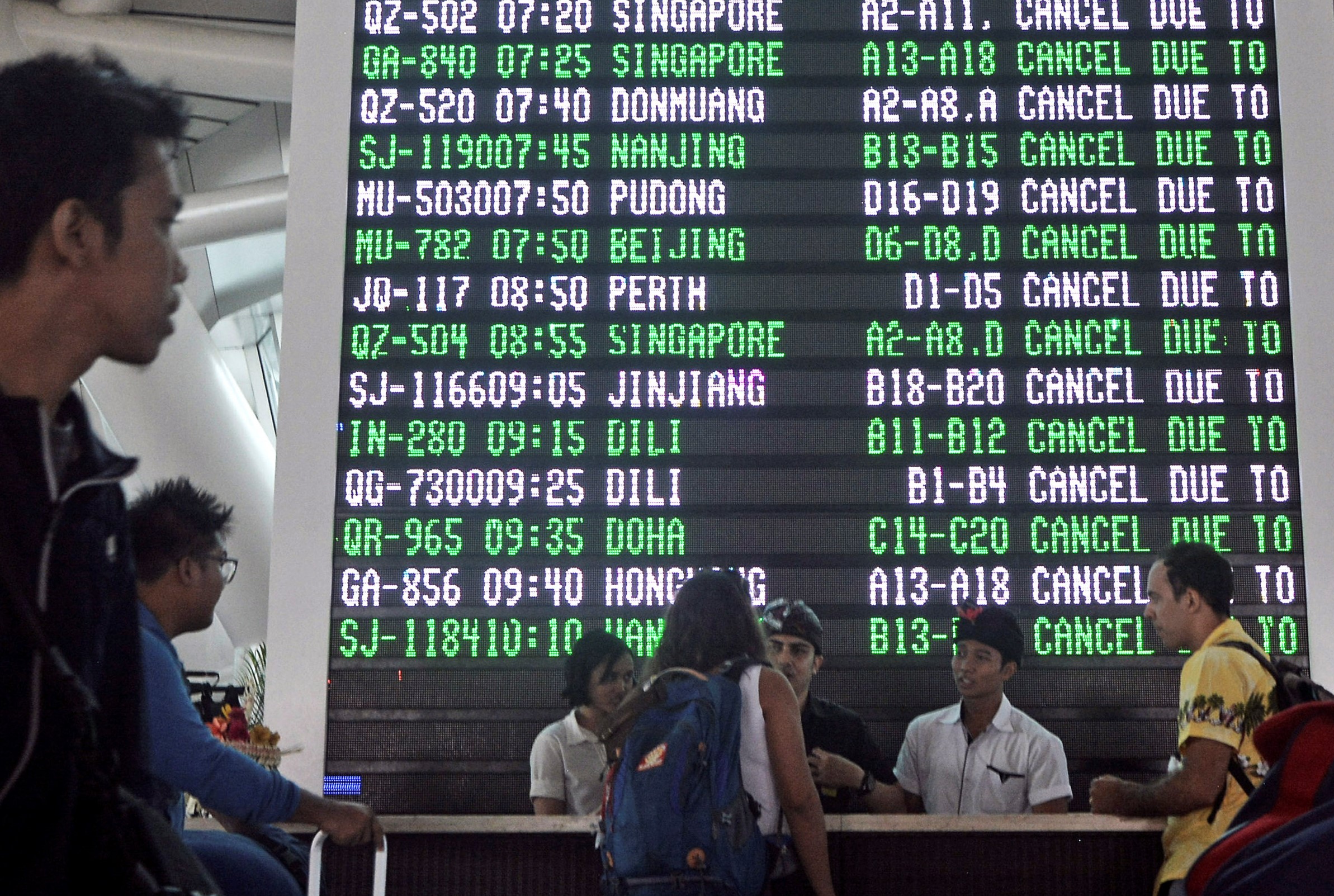 nPassengers ask staff about their flights near the flight screen after Ngurah Rai airport closed their operation due to eruption of Mount Agung in Bali resort island, November 27, 2017. u00e2u20acu201d Reuters pic 