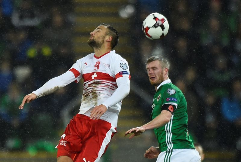 Northern Irelandu00e2u20acu2122s Chris Brunt in action with Switzerlandu00e2u20acu2122s Haris Seferovic during the 2018 World Cup qualification match in Belfast November 10, 2017. u00e2u20acu2022 Reuters pic