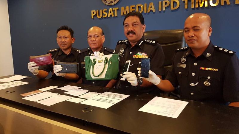 Northeast district police chief Assistant Commissioner Anuar Omar (second right) showing the items seized from the suspect believed to be involved in theft cases in a mosque and a surau.
