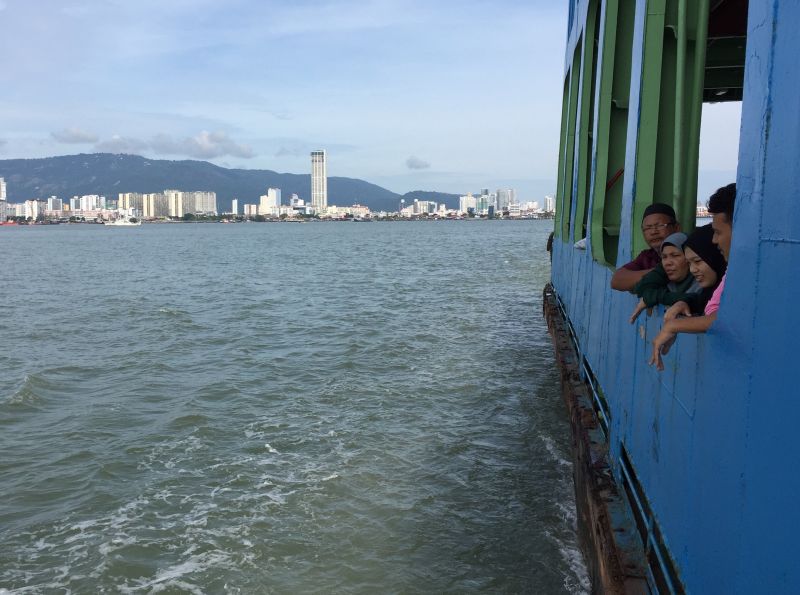 Passengers looking out at the clear blue skies from the ferry in George Town November 9, 2017. u00e2u20acu2022 Picture by KE Ooi