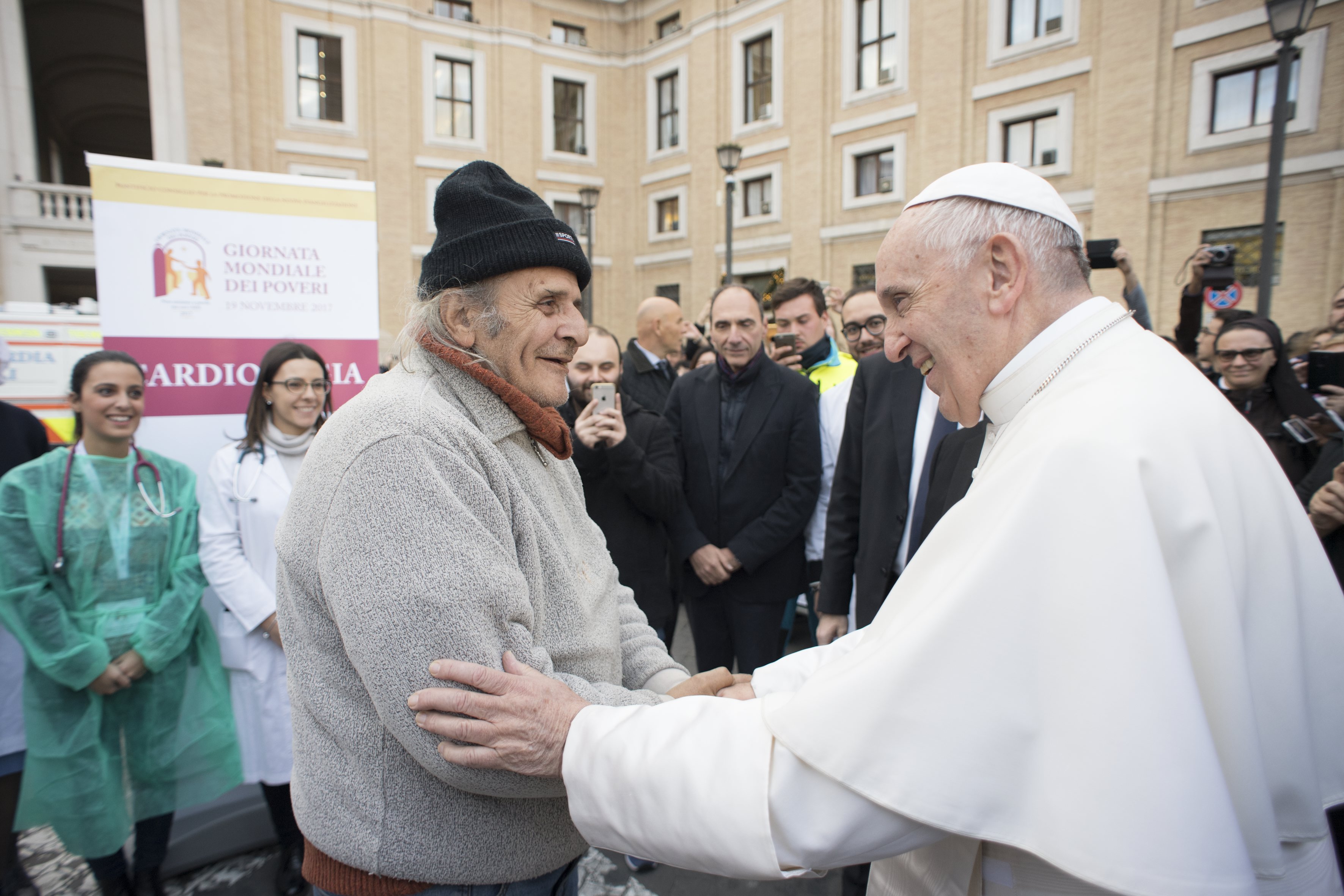 Pope Francis greeting a man during a visit to volunteers of the religious medical organisation 'Presidio sanitario delle Misericordie' on November 16, 2017 near the Vatican. u00e2u20acu201d AFP pic 