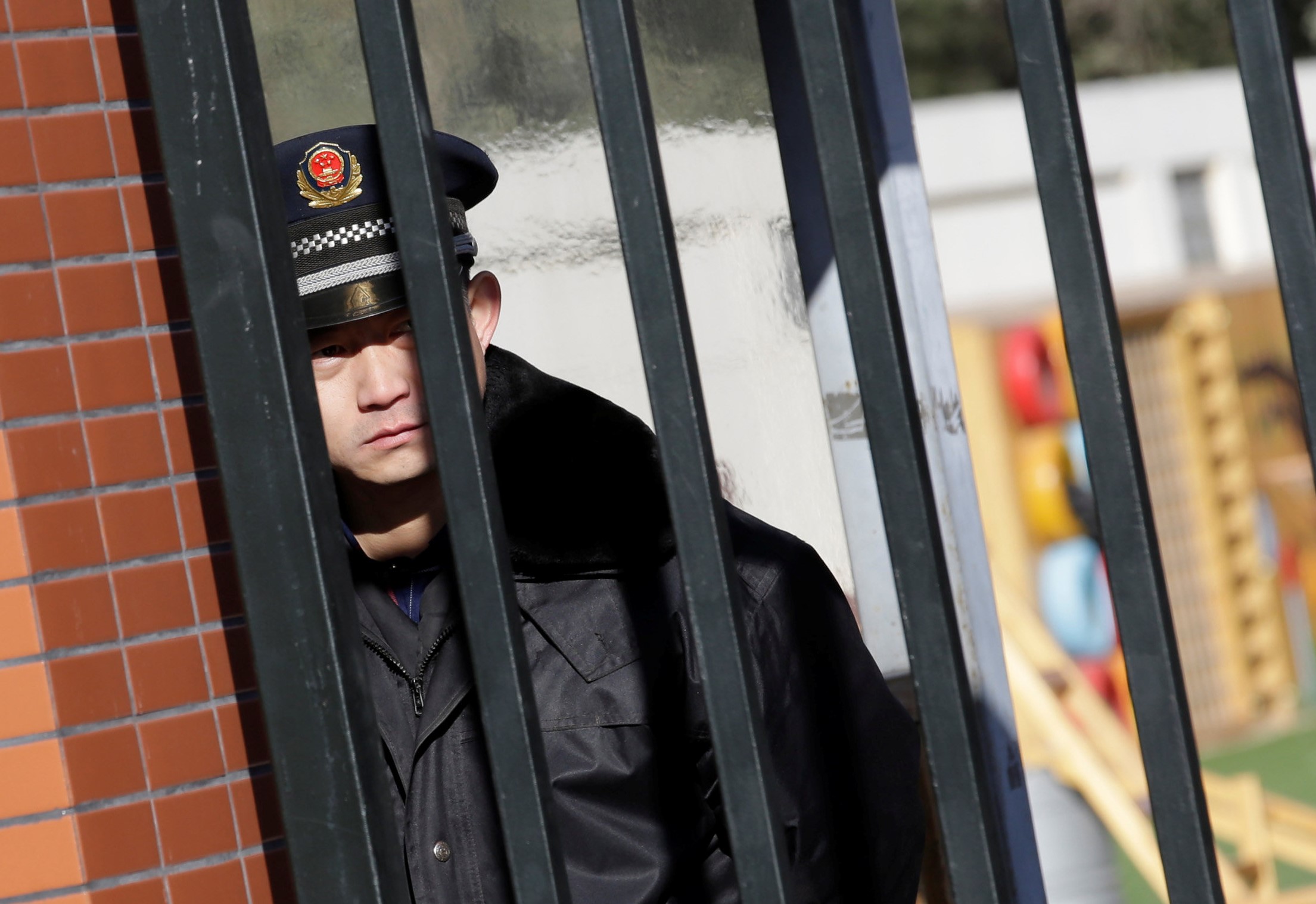 A security guard is pictured through the gate at the kindergarten run by pre-school operator RYB Education Inc being investigated by China's police, in Beijing, China November 24, 2017. u00e2u20acu201d Reuters pic 