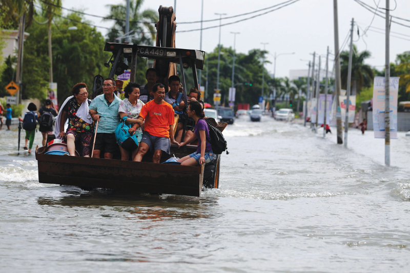 An excavator is used to evacuate flood victims in Bukit Mertajam November 5, 2017. u00e2u20acu201d Picture by Sayuti Zainuddin