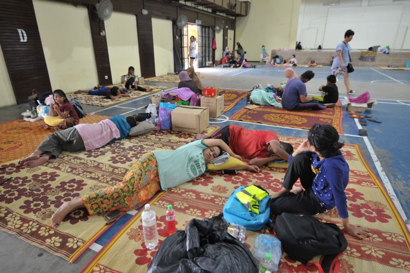 Flood evacuees are pictured catching up on rest at the Sungai Besar flood relief centre on November 6, 2017. u00e2u20acu201d Picture by KE Ooi