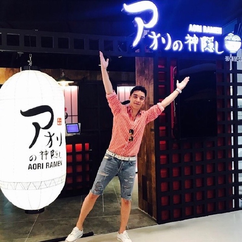 Seungri in front of an Aori Ramen store. u00e2u20acu201d Handout via TheHive.Asia