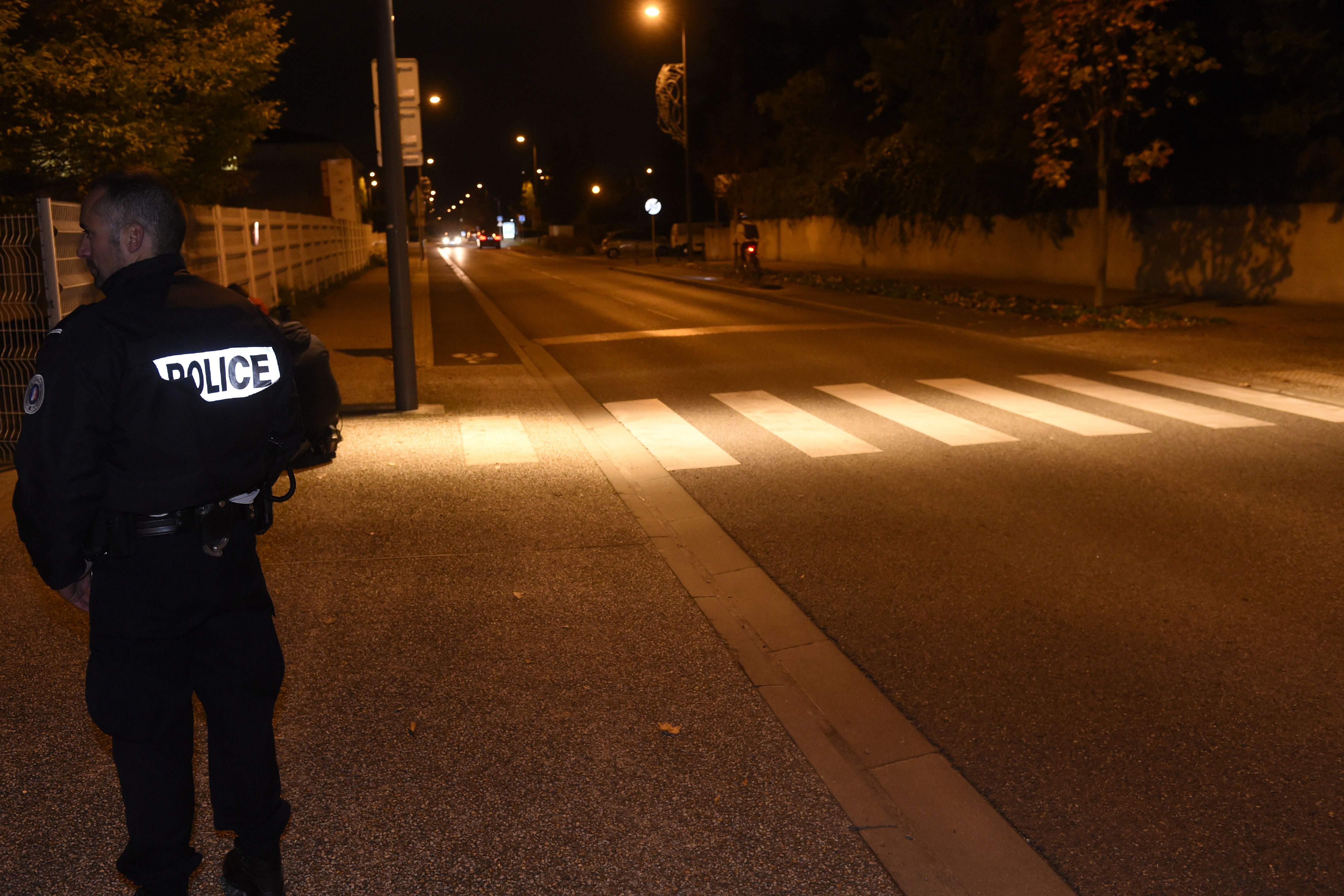 A policeman stands in a street where a man deliberately rammed his car into three Chinese students in Blagnac near the southern French city of Toulouse on November 10, 2017. u00e2u20acu201d AFP pic 
