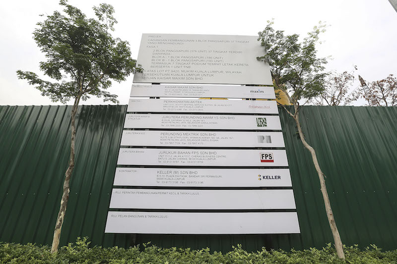 A construction signboard with two rows left blank is pictured at The Address' project site in Taman Desa, Kuala Lumpur. — Picture by Yusof Mat Isa