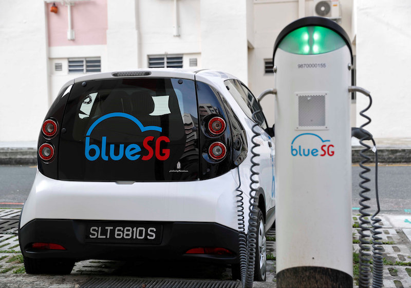 A BlueSG electric car-sharing vehicle is parked at a charging station in a public housing estate in Singapore December 12, 2017. u00e2u20acu201d Reuters pic