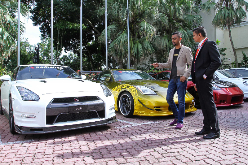 Datuk K. Sethambaram and Jai Prakash during a walkabout of the cars that were expected to make an appearance for test drives and rides during the event on December 23, 2017. u00e2u20acu201d Picture by Shafwan Zaidon