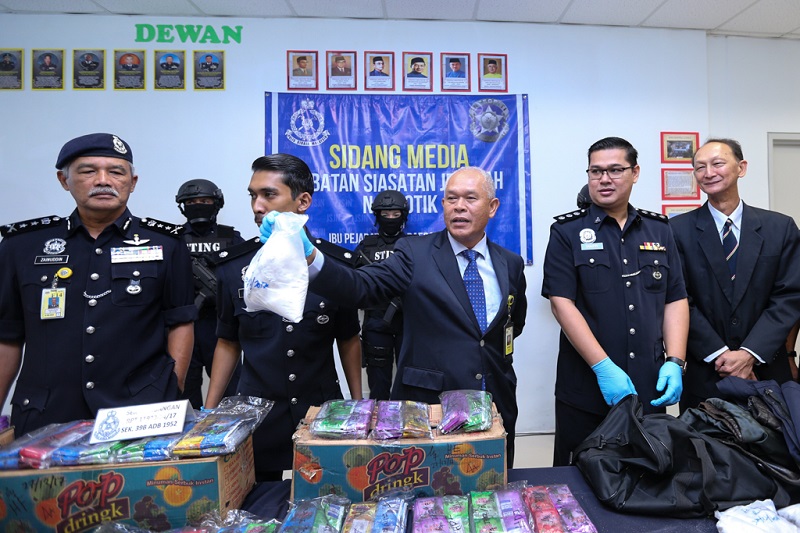 Narcotic Criminal Investigation Department Director Datuk Seri Mohmad Salleh (centre) displays some of the confiscated drugs found during a drug bust earlier this week, in Kuala Lumpur December 29, 2017. u00e2u20acu201d Picture by Ahmad Zamzahuri