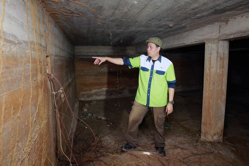 Shaharom Ahmad inside the World War II bomb shelter.
