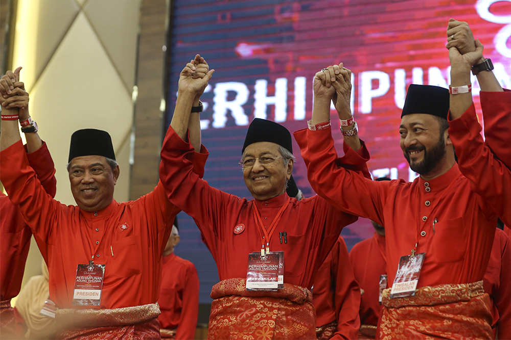 Picture shows (from left) Tan Sri Muhyiddin Yassin, Tun Dr Mahathir Mohamad and Datuk Seri Mukhriz Mahathir raising their hands during Parti Pribumi Bersatu Malaysiau00e2u20acu2122s first Annual General Assembly at Ideal Convention Centre, Shah Alam, December 30, 20