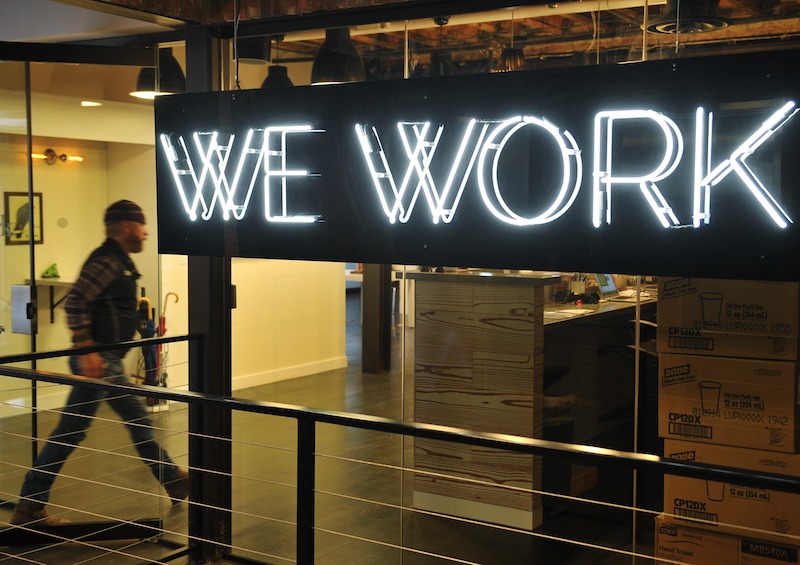 A man enters the doors of the WeWork co-operative co-working space in Washington March 13, 2014. u00e2u20acu201d AFP pic 