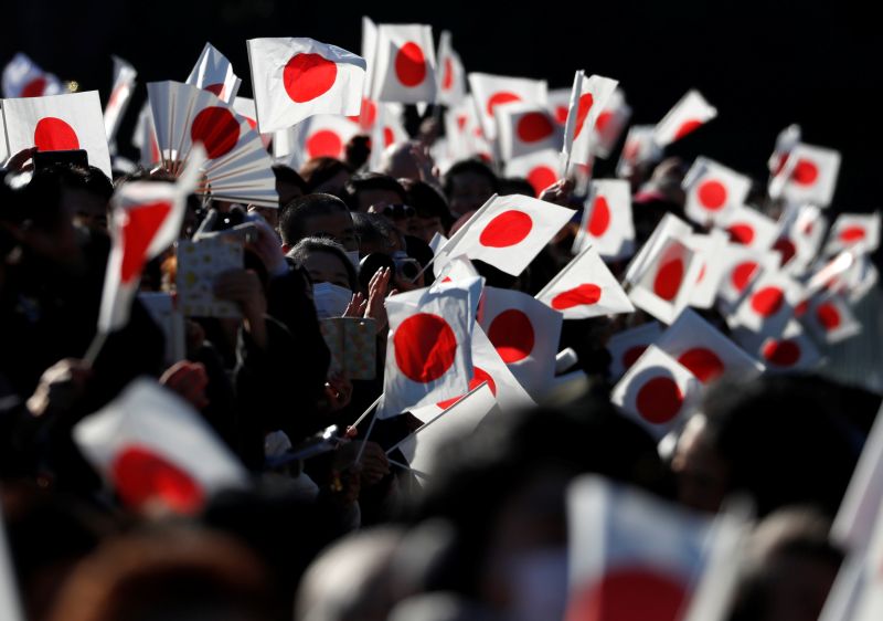 Well-wishers wave Japanese national flags as Japanu00e2u20acu2122s Emperor Akihito (not pictured) appears on a balcony of the Imperial Palace to celebrate his 84th birthday in Tokyo, Japan, December 23, 2017. u00e2u20acu2022 Reuters pic