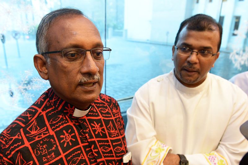 Christian Federation of Malaysiau00e2u20acu2122s general secretary, Rev Dr. Herman Shashtri (left) and Fr George Harrison speaking to reporters in Kuala Lumpur, December 25, 2017. u00e2u20acu201d Picture by Miera Zulyana