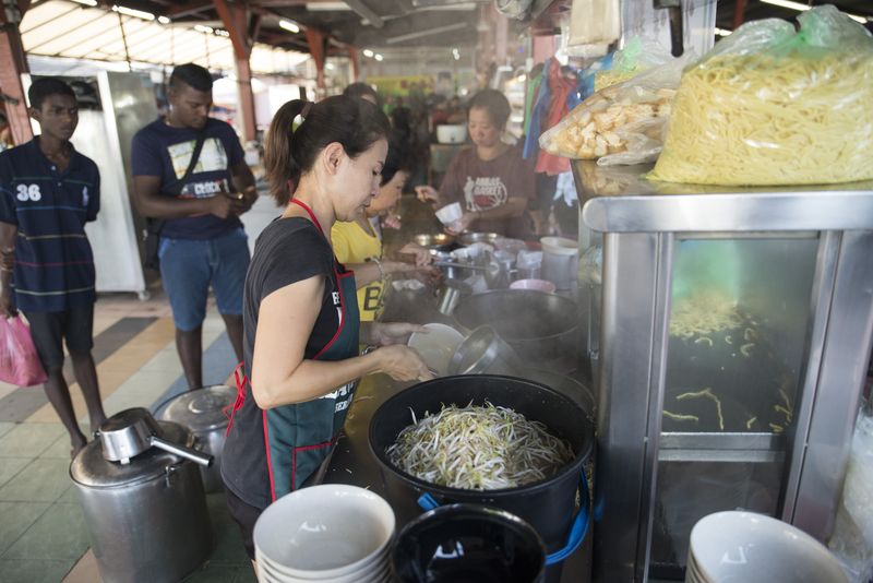 The Tang siblings manning the curry mee stall at the Butterworth Old Market food court.