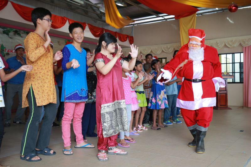 Children from Rumah Kebajikan Kanak Kanak Cacat Negeri Perak perform a special dance during the Christmas party held by Takashima Woodwork Sdn Bhd. u00e2u20acu201d Picture by Pheong Kar Yu