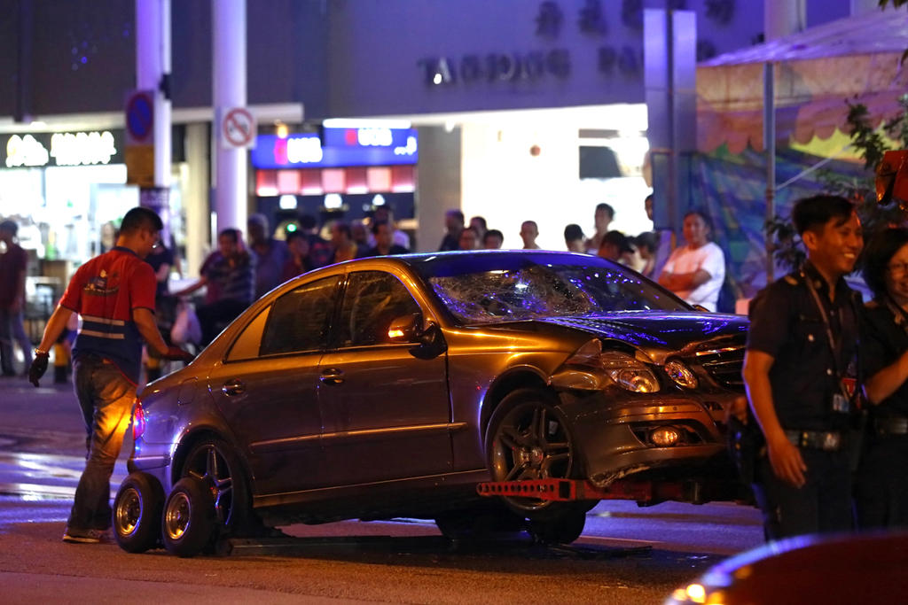 A Mercedes car is towed away after an accident along Tanjong Pagar Road on Dec 7, 2017. u00e2u20acu201d Picture by Nuria Ling/TODAY