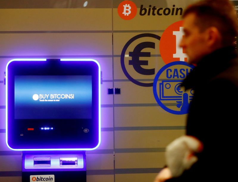 File picture shows a man walking past a bitcoin ATM in Vilnius, Lithuania December 6, 2017. u00e2u20acu201d Reuters pic