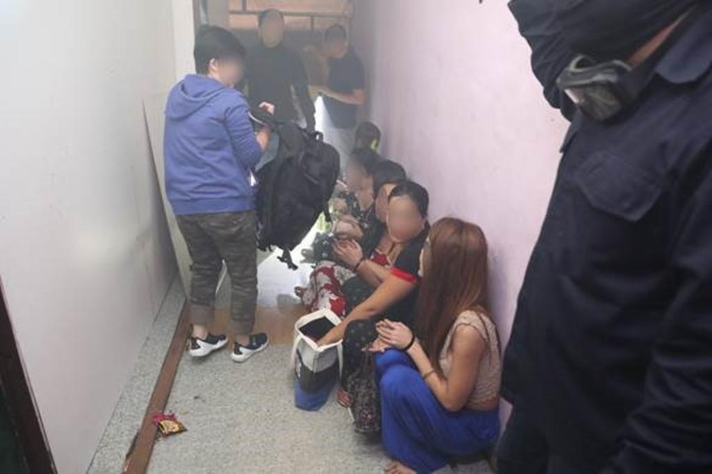 Twenty-two people were arrested for their suspected involvement in vice-related activities during police raids at brothels in the vicinity of Rowell Road. u00e2u20acu201d Picture courtesy of  Singapore Police Force