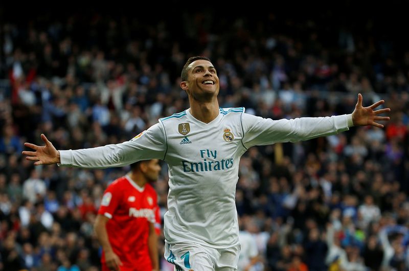 Real Madridu00e2u20acu2122s Cristiano Ronaldo celebrates scoring their second goal against Sevilla during their La Liga match at Santiago Bernabeu, Madrid, December 9, 2017. u00e2u20acu201d Reuters pic