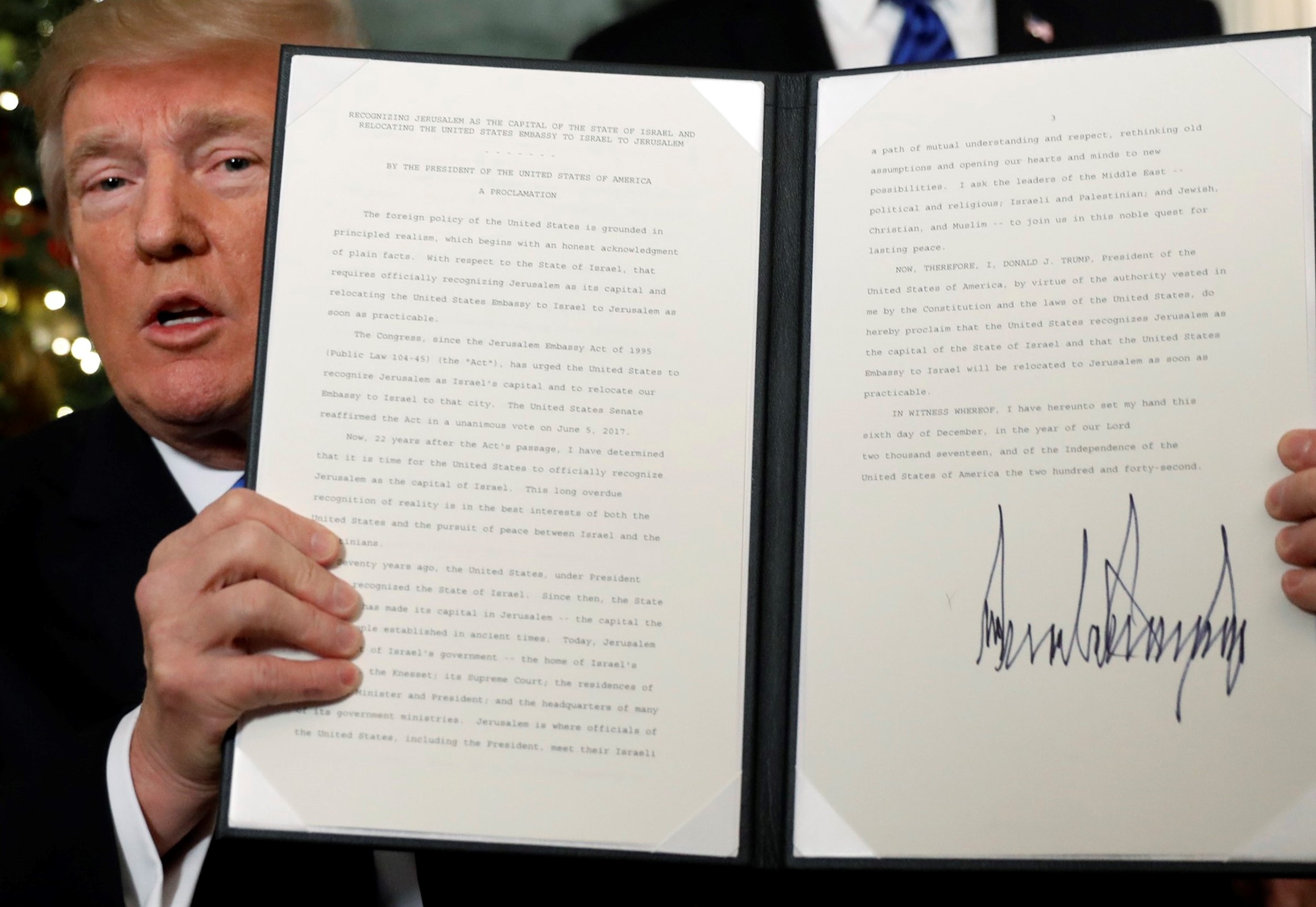US President Donald Trump displays an executive order after he announced the US would Jerusalem as the capital of Israel at the White House in Washington, December 6, 2017. u00e2u20acu201d Reuters pic