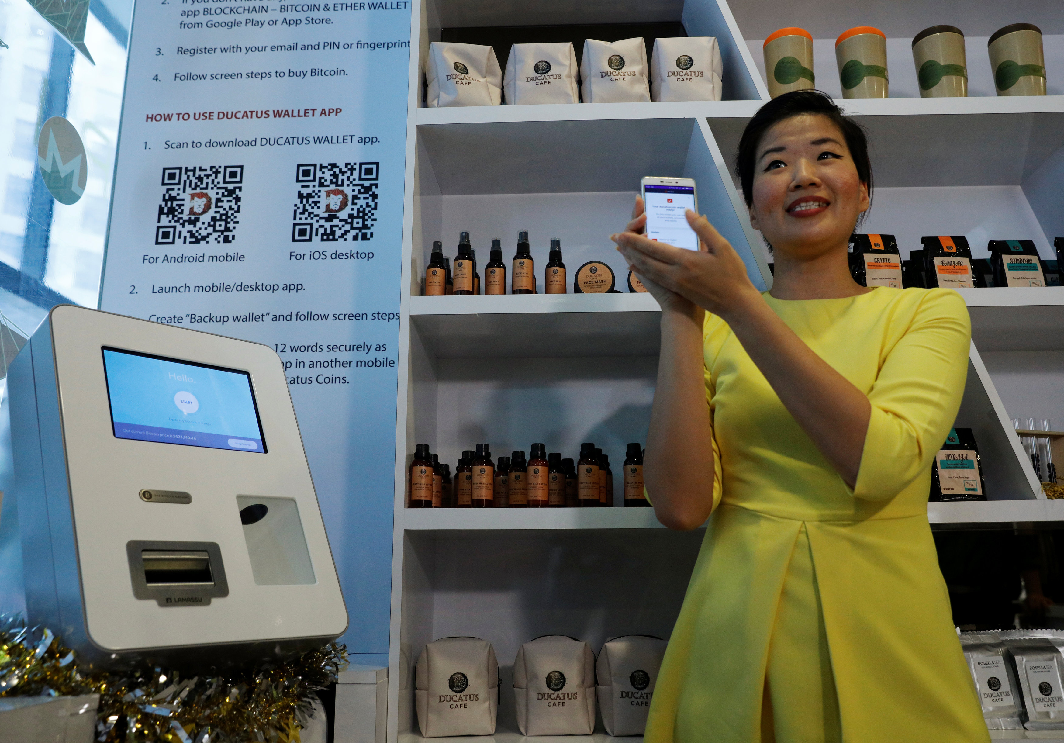 Ducatus cafe operations manager Frances Sy introduces a Bitcoin ATM at the opening of their cashless cafe that accepts cryptocurrencies such as Bitcoin in Singapore December 21, 2017. u00e2u20acu201d Reuters pic 