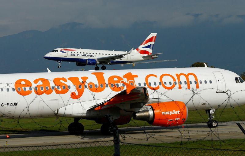 A British Airways aircraft lands next to an EasyJet plane ready for takeoff at Cointrin airport in Geneva, Switzerland September 26, 2017. u00e2u20acu201d Reuters pic