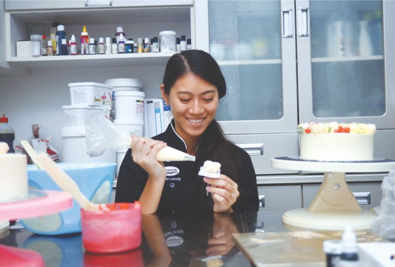 Karen Leong is a 19-year-old who gave up conventional education to pursue her passion in cake decorating. u00e2u20acu2022 Picture by Khafiz Rahim