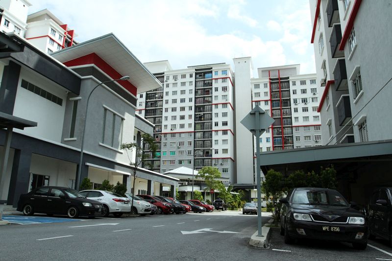 More and more lower-income earners are buying medium-cost flats and renting them out or flipping them for profit. u00e2u20acu201d Picture by Miera Zulyana 