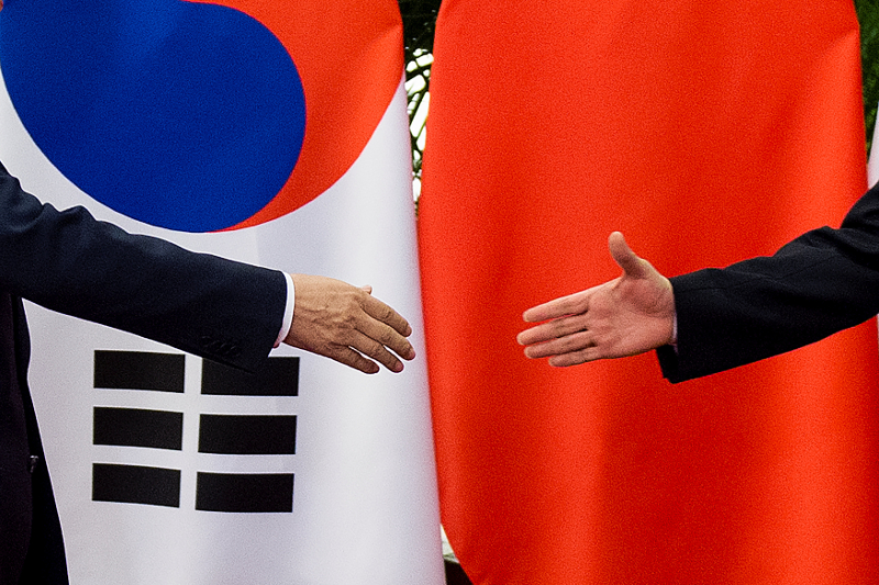 South Koreau00e2u20acu2122s President Moon Jae-In (left) shakes hands with Chinau00e2u20acu2122s Premier Li Keqiang (right) at the Great Hall of the People in Beijing December 15, 2017. u00e2u20acu201d Reuters pic