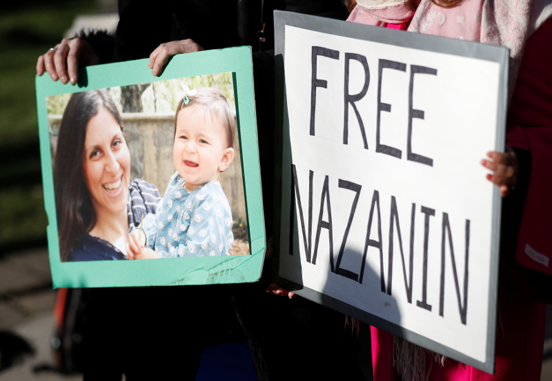 Demonstrators hold placards before a march in support of Nazanin Zaghari-Ratcliffe, the British-Iranian mother who is in jail in Iran, in London November 25, 2017. u00e2u20acu201d Reuters pic