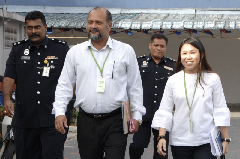 Senai assemblywoman Wong Shu Qi (right) and DAPu00e2u20acu2122s Puchong MP Gobind Singh Deo who acted as her counsel, are pictured after investigating officers recorded Wongu00e2u20acu2122s statement at police headquarters in Johor Baru, December 8, 2017. u00e2u20acu201d Malay Mail/Roslan K