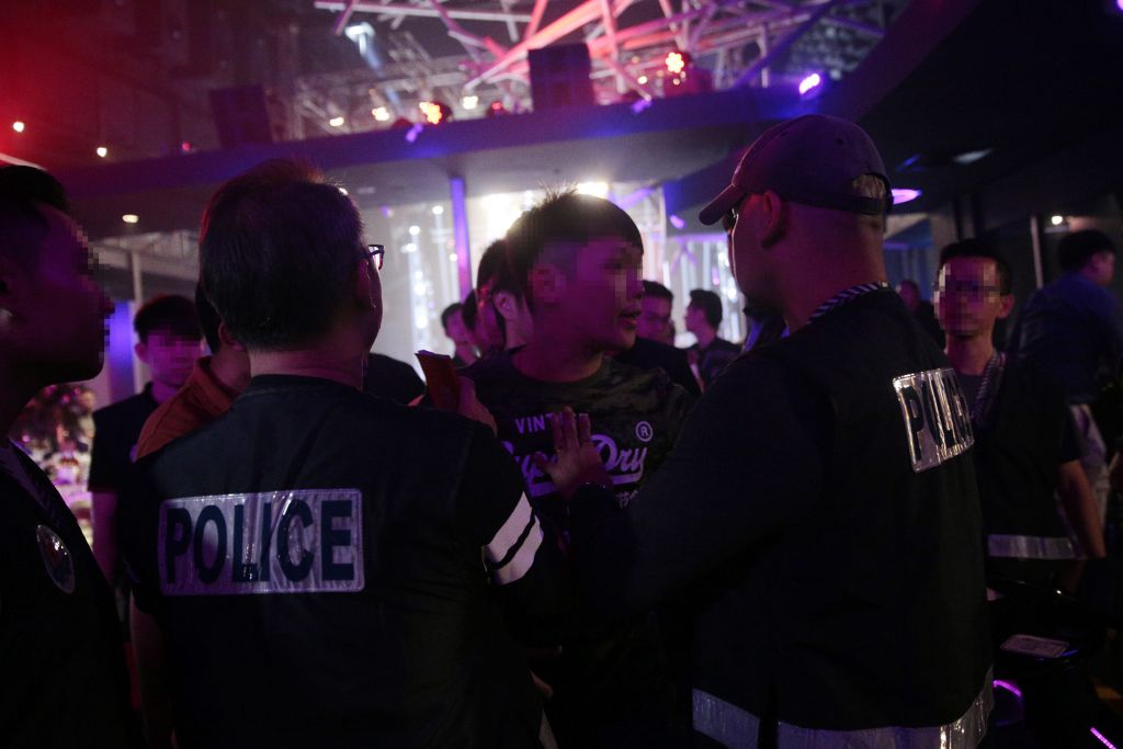 A man argues with police officers as he is arrested during an enforcement operation in a nightclub at St James Powerstation, December 3, 2017. u00e2u20acu201d Picture by Jason Quah/TODAY