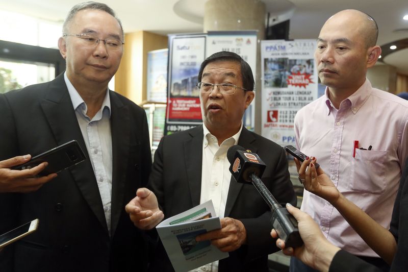 Cheras MP Tan Kok Wai (centre) speaks to reporters after a meeting with the KL Mayor at Menara DBKL in Kuala Lumpur December 12, 2017. u00e2u20acu2022 Picture by Yusof Mat Isa