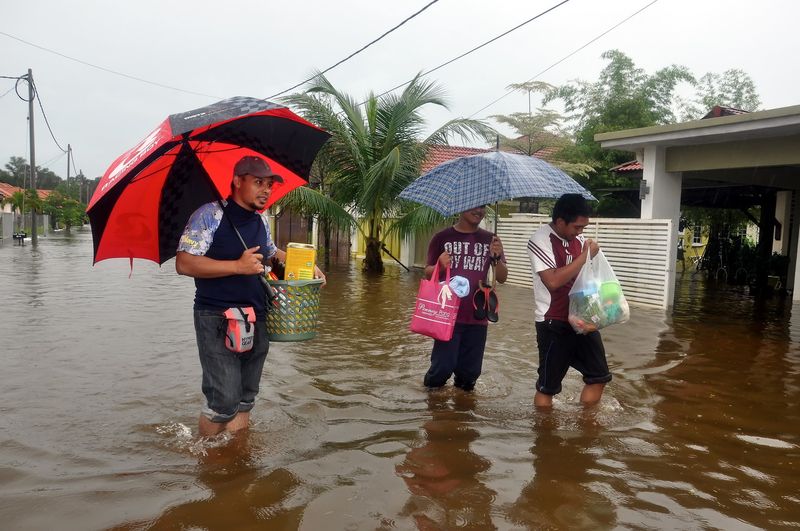 Residents of Taman Desa Tanjung Damai in Kuala Nerus, Terengganu preparing to be evacuated to a flood relief centre, December 2, 2017. u00e2u20acu201d Bernama pic