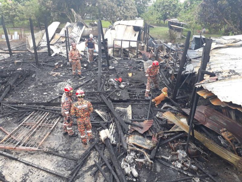 The rubble left behind after the wooden house was torched this morning. u00e2u20acu2022 Picture courtesy of Selangor Fire and Rescue Department