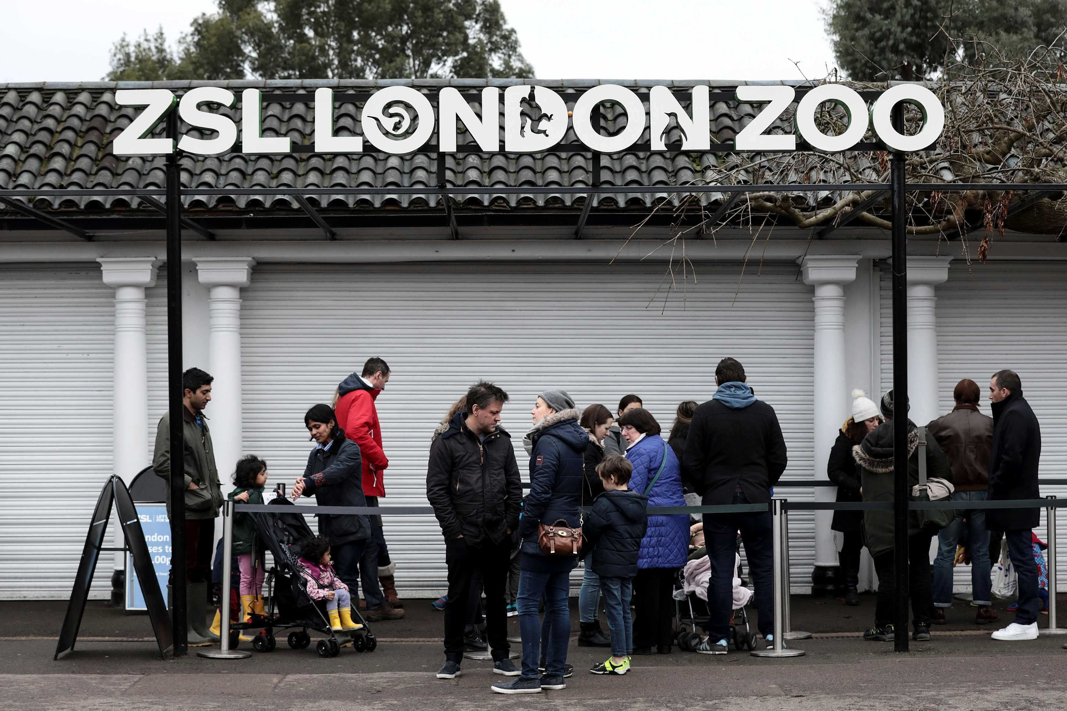 Customers queue to enter London Zoo as it reopens following a fire which broke out at a shop and cafe at the attraction, in central London, Britain December 24, 2017. u00e2u20acu201d Reuters pic 