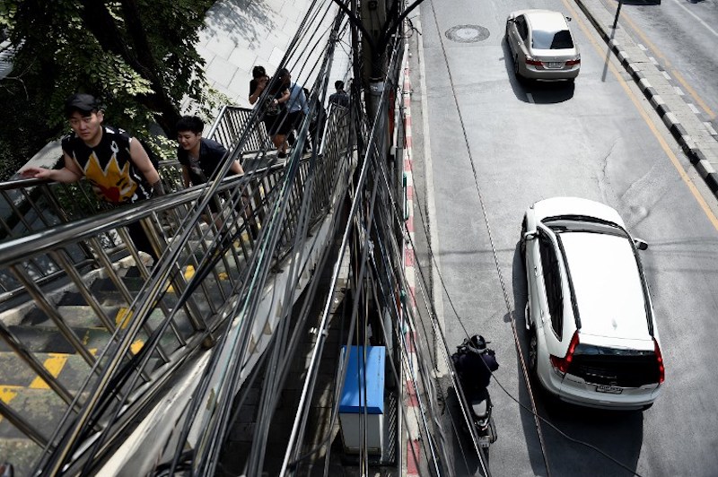 A network of cables is strung along a crosswalk over Wireless Road in Bangkok January 3, 2018. u00e2u20acu201d AFP pic