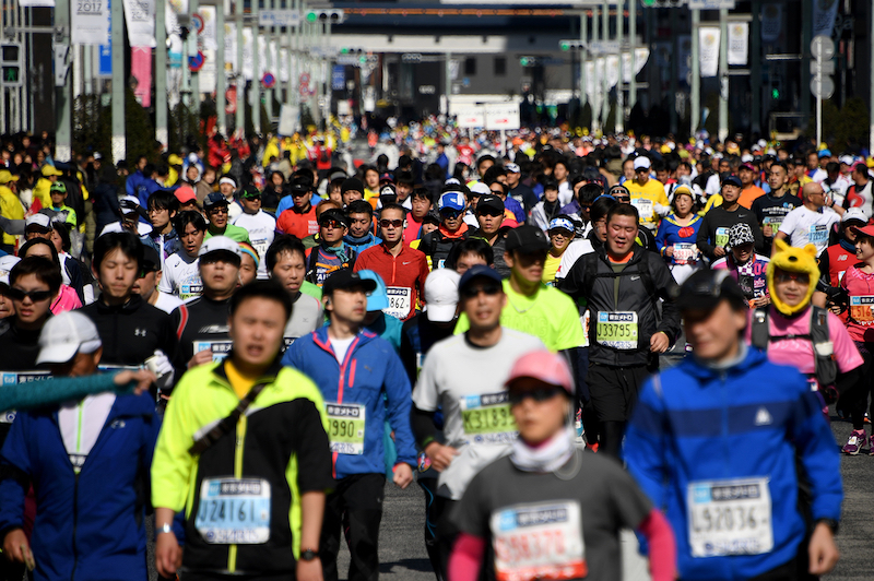 Runners pass the Ginza shopping district during the Tokyo Marathon 2017 in Tokyo. u00e2u20acu201d AFP pic