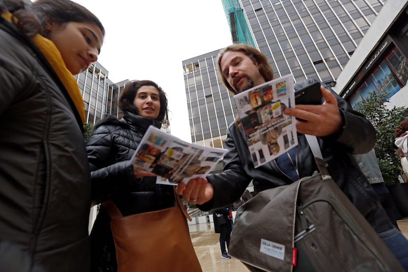 Tour guide Ronnie Chatah, 36, gives the tour brochures to visitors in Beirut January 28, 2018. u00e2u20acu201d Reuters pic