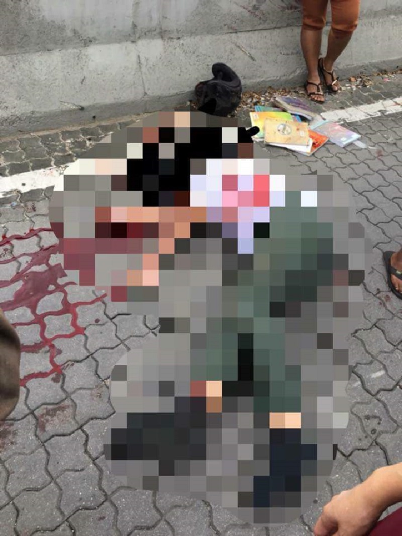 The student lying in a pool of blood after he was hit by a van in Johor Baru. — Picture via Facebook/ Harry Cyclone